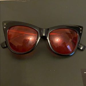 Black sunglasses with red lenses